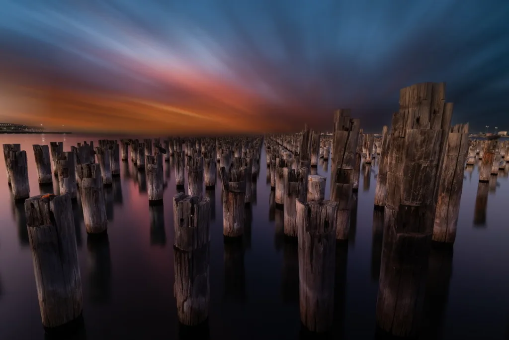 wooden posts in the water
