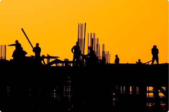 Silhouette of construction worker in the sunset