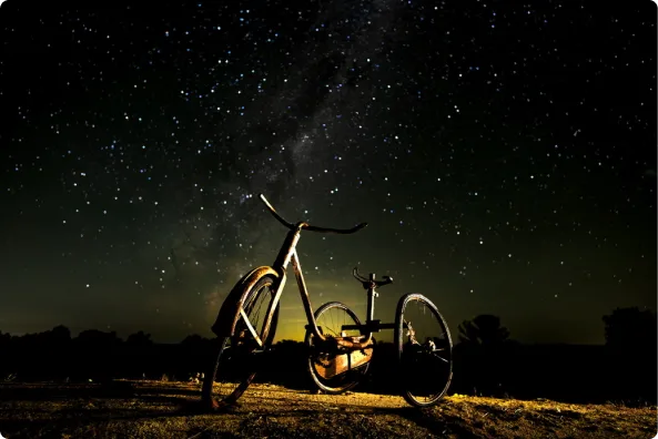 A bicycle under the night sky